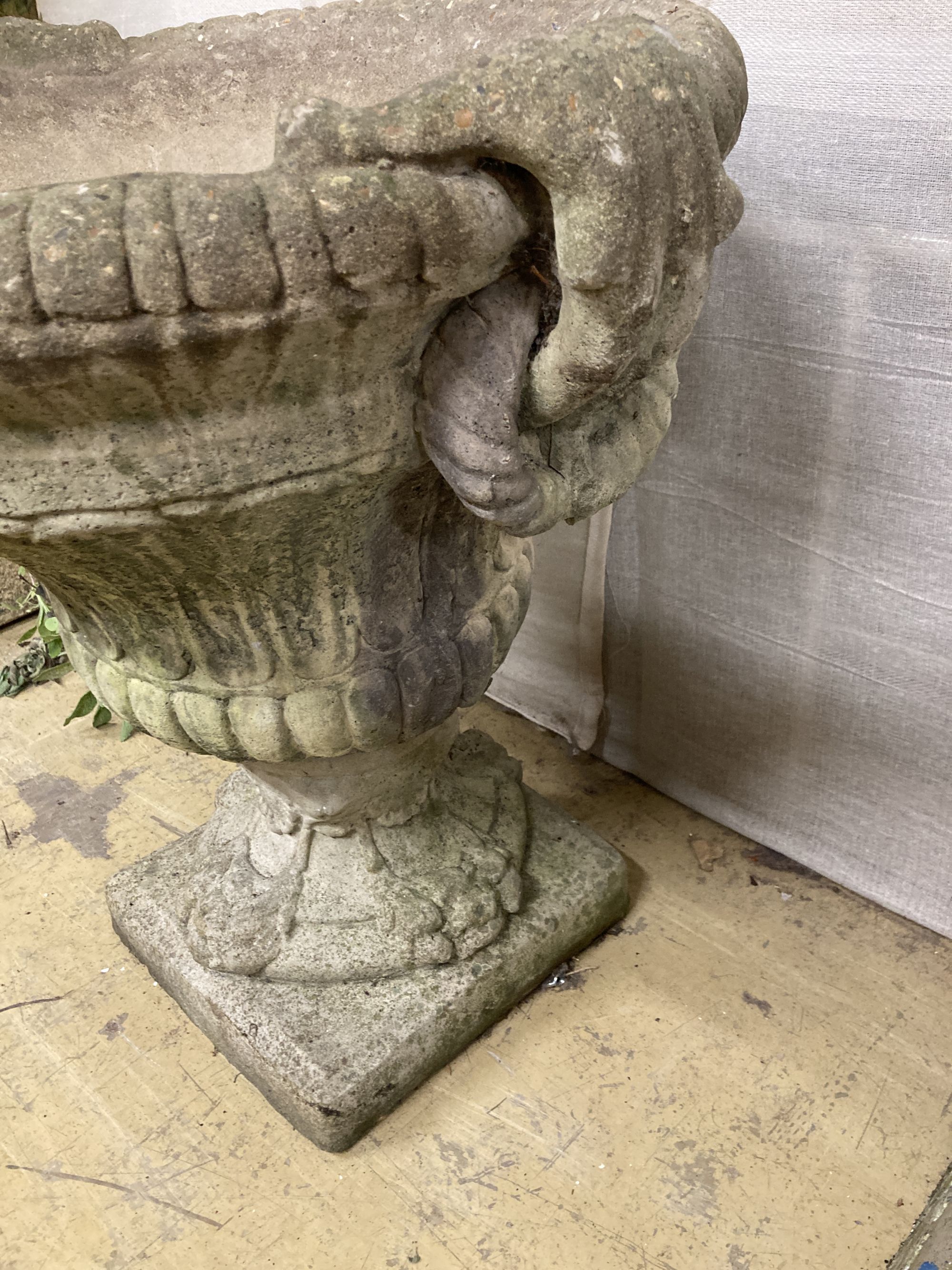 A reconstituted stone campana garden urn, width 66cm, depth 60cm, height 64cm